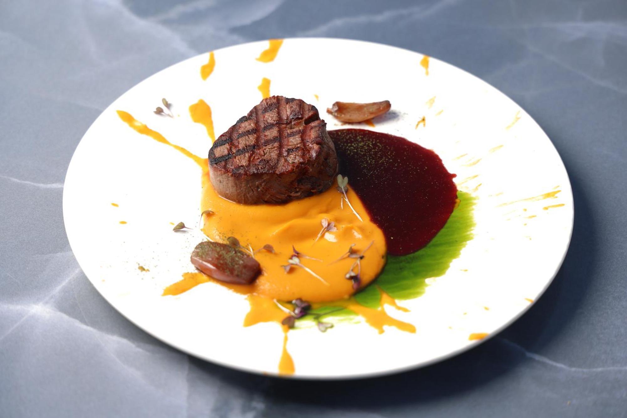 Alia Palace Hotel - Adults Only 16+ Chalkidiki Bagian luar foto A steak with a pumpkin sauce