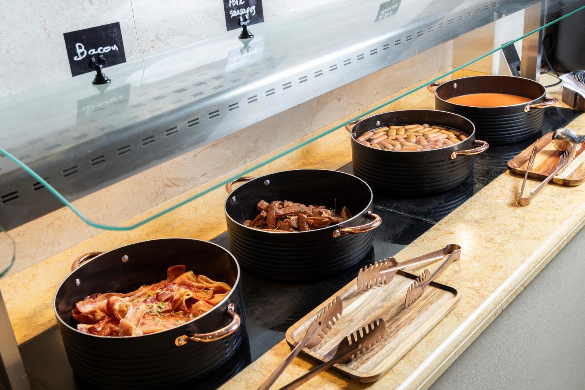 Alia Palace Hotel - Adults Only 16+ Chalkidiki Bagian luar foto Bacon, sausage, chicken and cheese at a salad bar