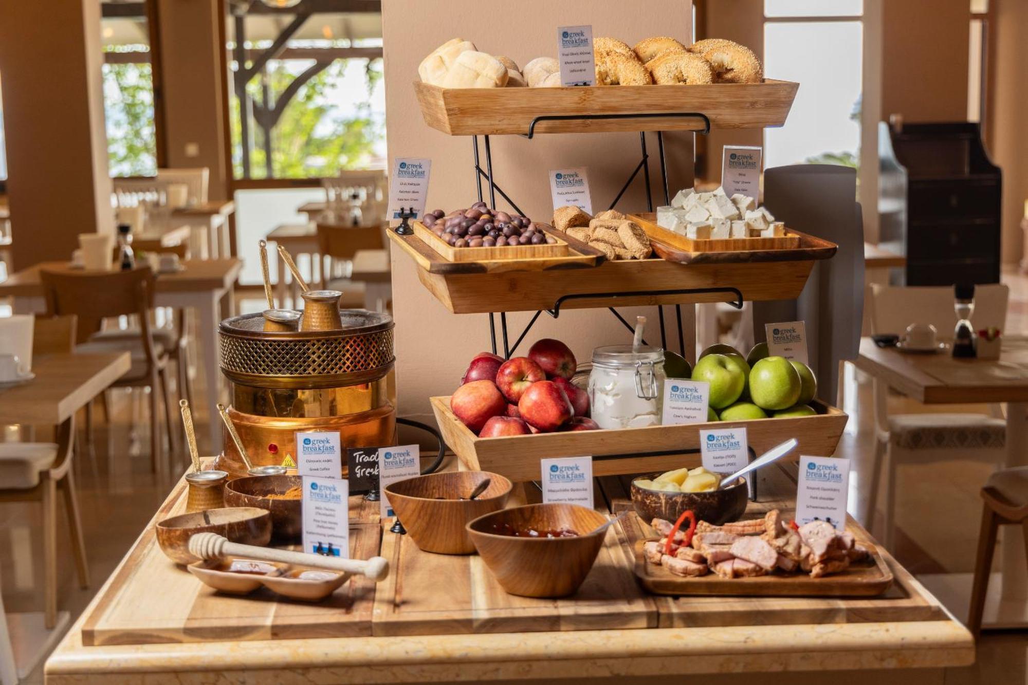 Alia Palace Hotel - Adults Only 16+ Chalkidiki Bagian luar foto A buffet at a hotel
